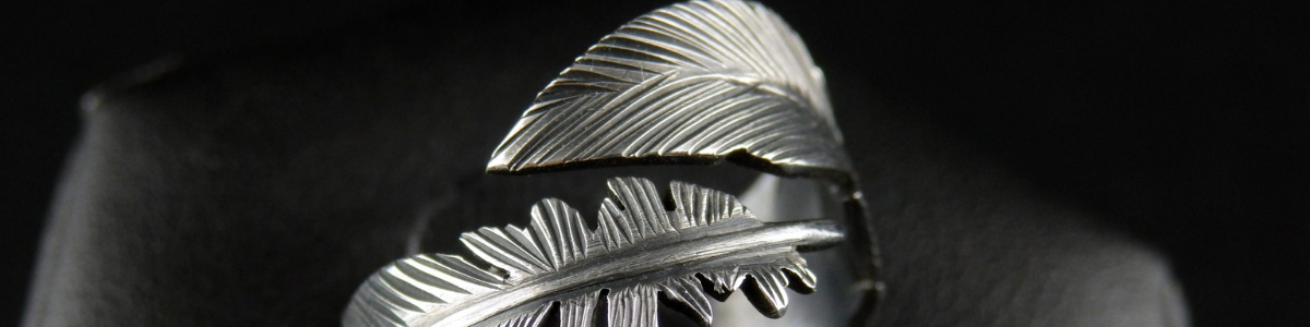 WHAT DOES A FEATHER MEAN IN JEWELRY?